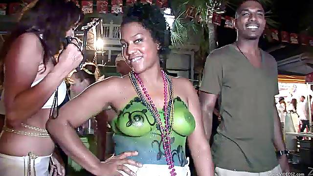 Lusty bitches with piercing show their natural tits in public