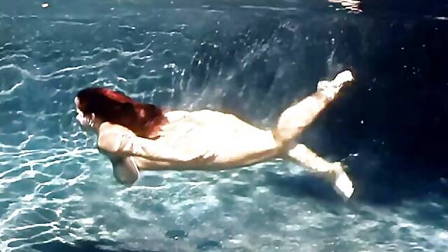 An awesome BBW babe Cherry Brady swims in the pool with boobs naked