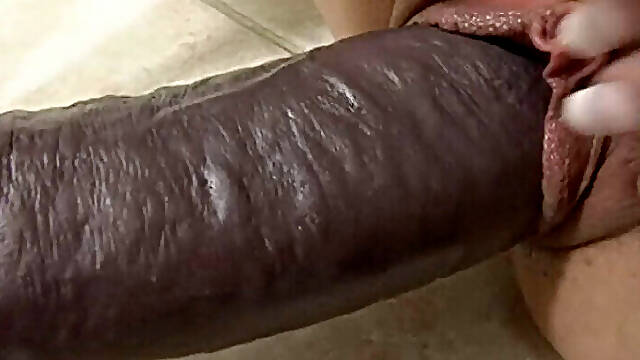 Busty blonde in thigh highs loving a big brutal dildo. Tatiana and her huge tits bounce up and...