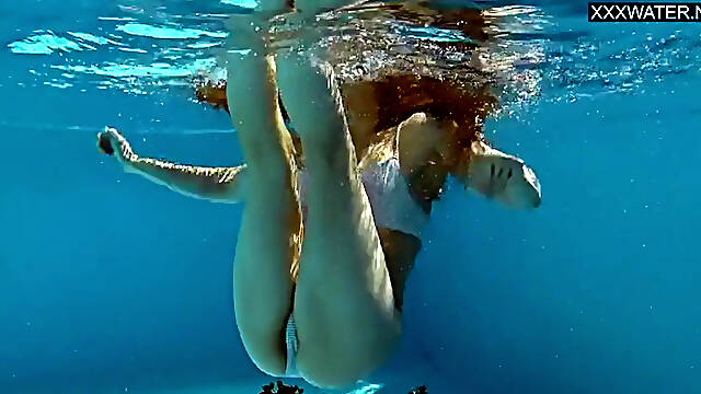 Hot Blonde Mia Split Teases in Pool