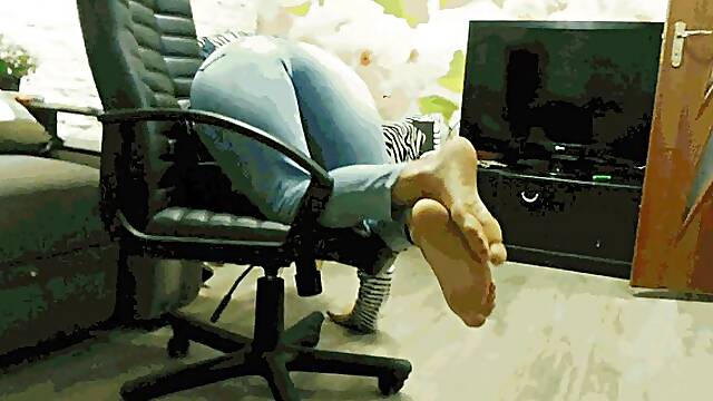 Office chair in jeans and zebra sweat shirt AVI