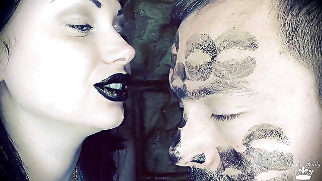 Covering Alex with black shiny lipstick kisses all over his face!